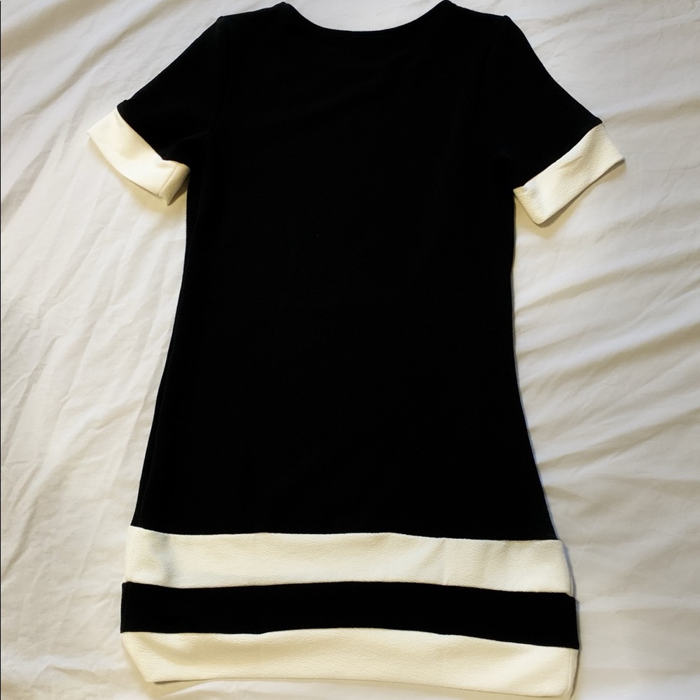 Simple symmetrical black dress